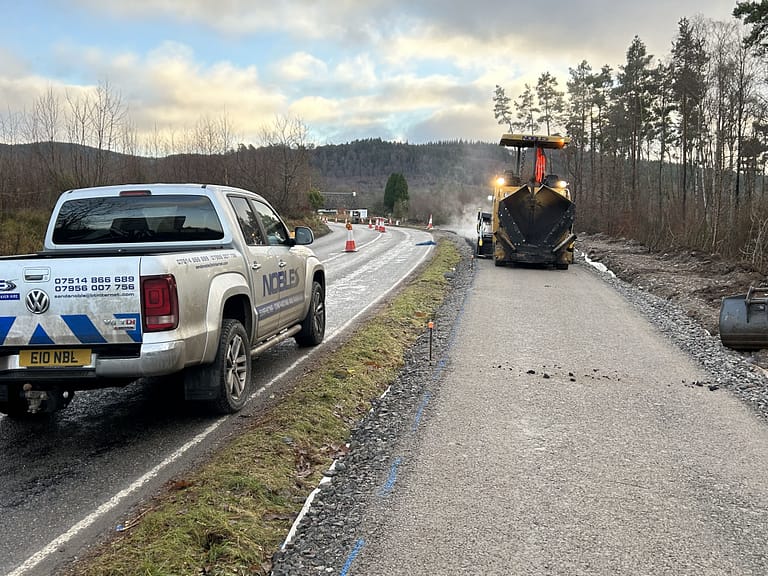 Noble Surfacing paving machine at work completing a cycle lane near Beauly